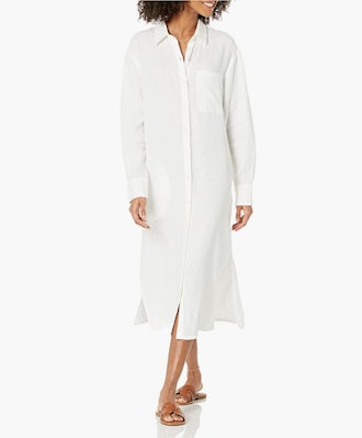 This 100% linen shirt dress has long sleeves and midi length with a side-split hem