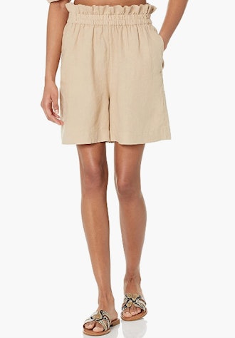 These loose, pull-on linen shorts have a paper bag waist and a trendy, mid-thigh length