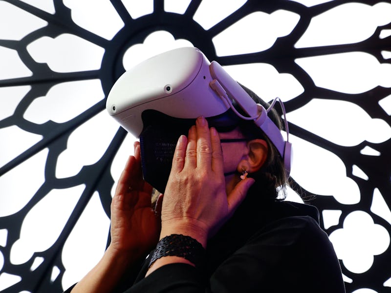 A woman using an Quest 2 VR headset in shock