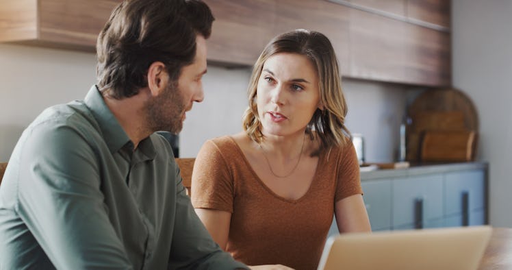 Couple in kitchen arguing