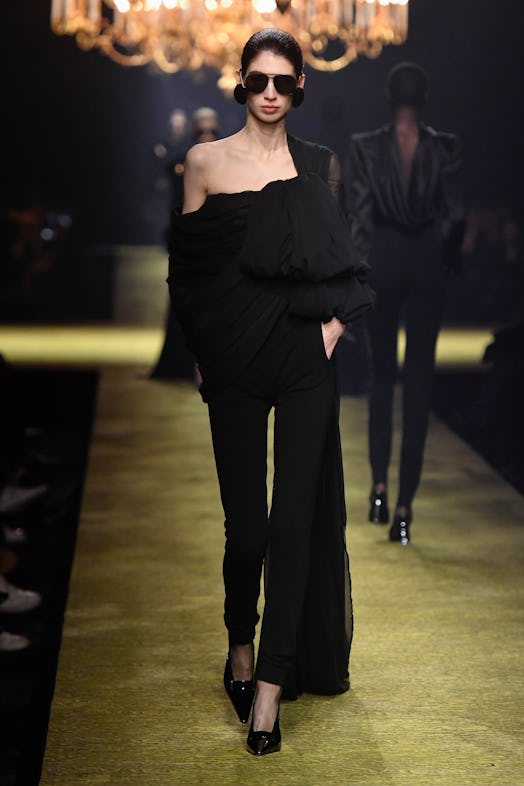 A model walks the runway during the Saint Laurent Ready to Wear Fall/Winter 2023-2024 fashion show a...
