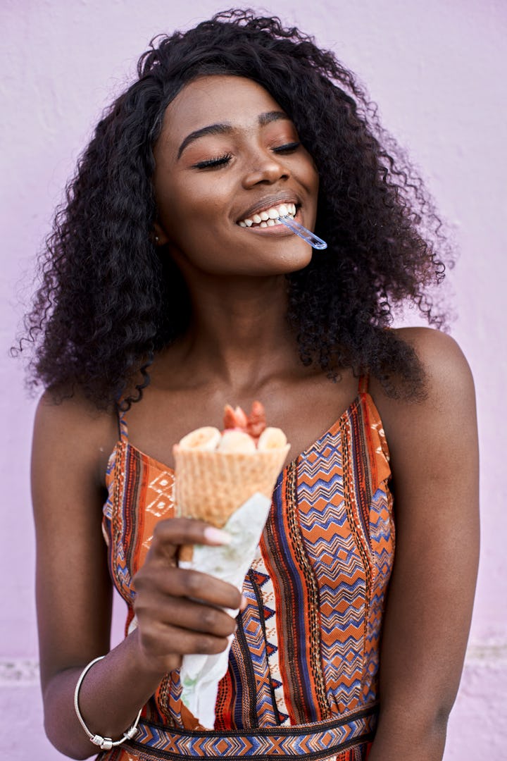 Happy woman enjoying ice cream
