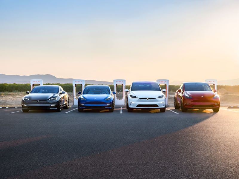 Teslas charging via Supercharger stations.