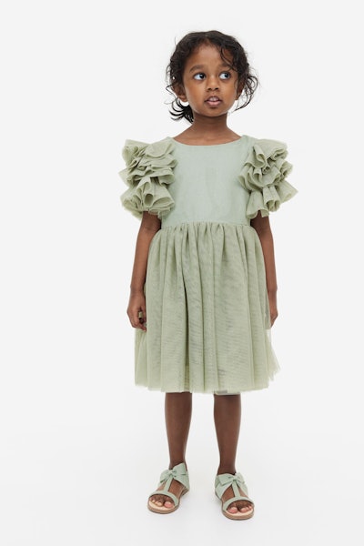 Green toddler dress with ruffle sleeves, a beautiful option to choose when shopping for kids easter ...