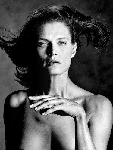 Model Malgosia Bela posing topless.