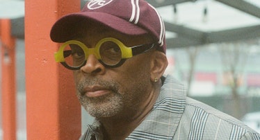 Spike Lee wears a Kith & MLB for New York Yankees coat; Polo Ralph Lauren for Morehouse College cap ...
