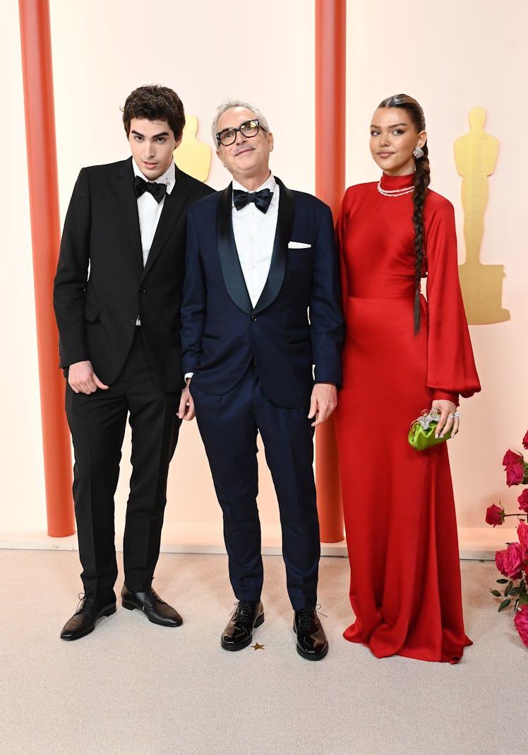 Olmo Teodoro Cuaron, Alfonso Cuaron, and Tess Bu Cuaron at the 95th Annual Academy Awards held at Ov...