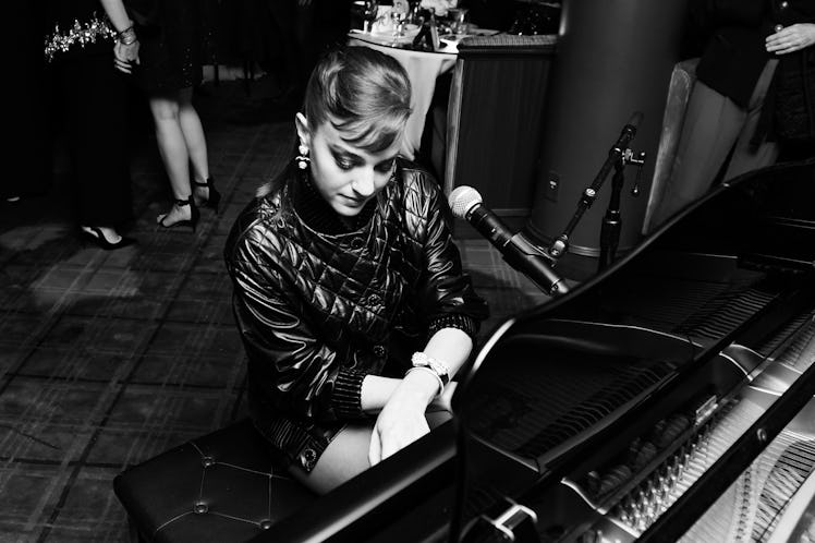 Beatrice Granno playing piano at Chanel and Charles Finch’s pre-Oscar awards dinner at the Polo Loun...