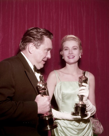 American actors Edmond O'Brien and Grace Kelly with their Oscars at the 27th Academy Awards ceremony