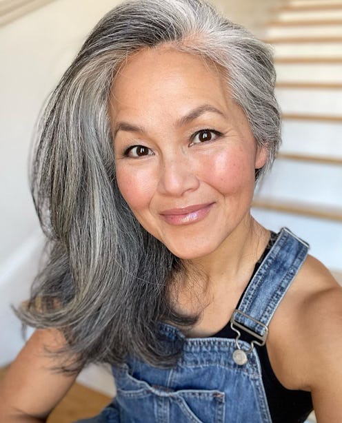 jin cruse with silver hair and natural rosy makeup