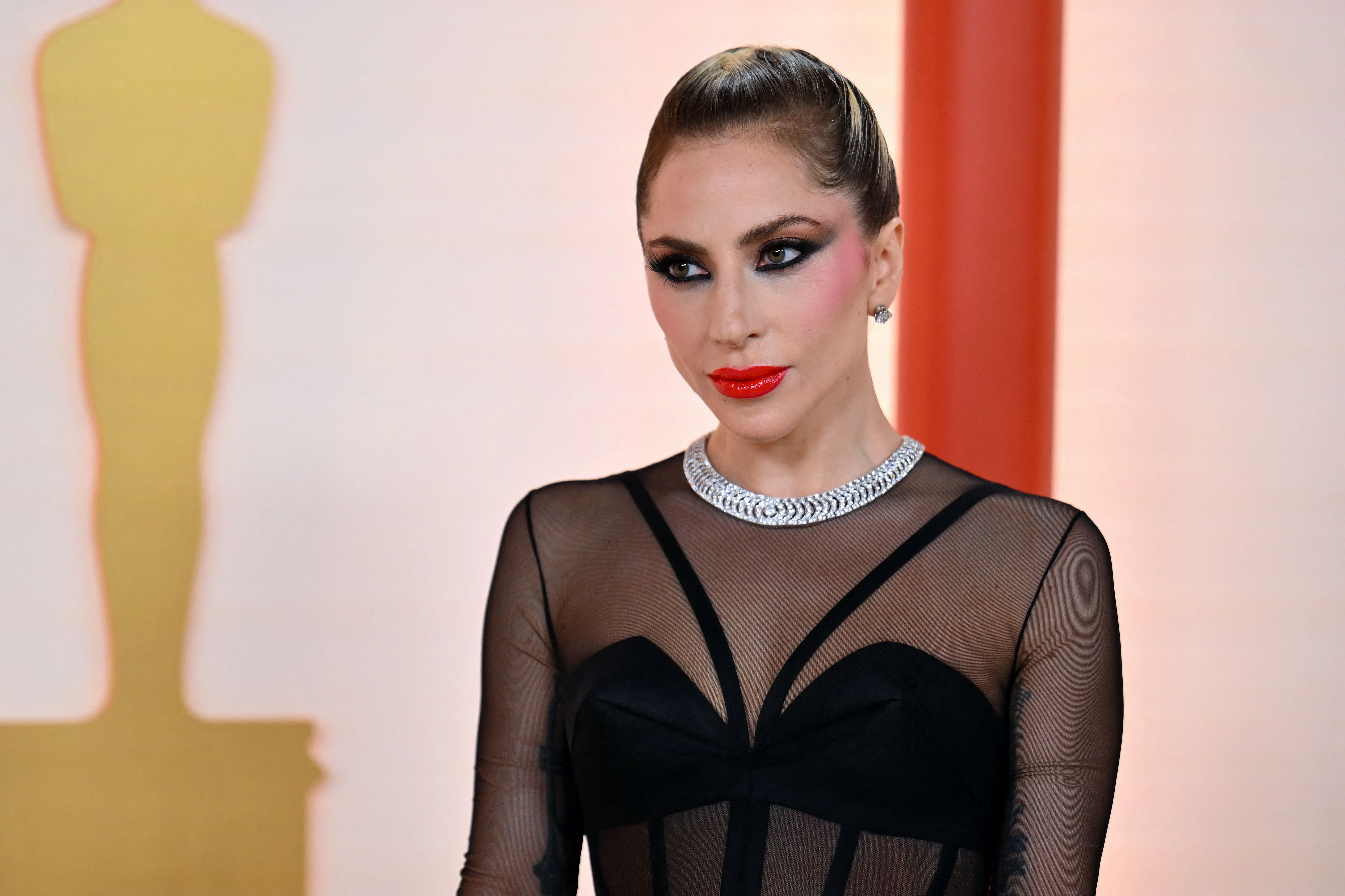 Lady Gaga's 2023 Oscars Dress Was Originally Worn By Gigi Hadid On The  Versace Runway