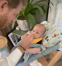 A snapshot of Prince Harry feeding his son Archie. 
