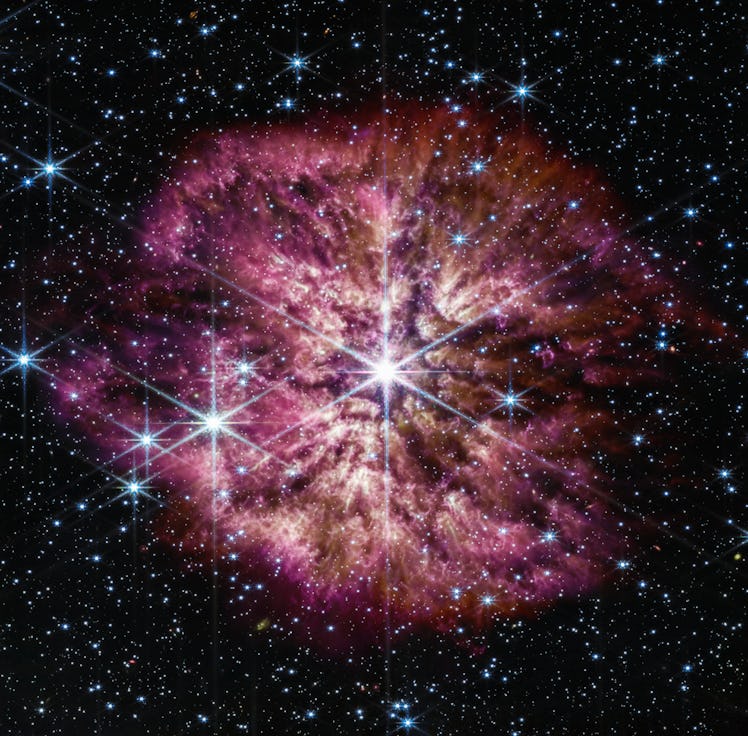 A bright core sparkles at the image center. It’s surrounded by dust, and looks like it has been emit...