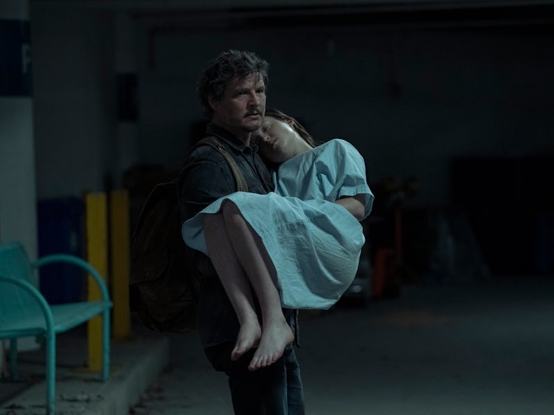 Joel (Pedro Pascal) holds an unconscious Ellie (Bella Ramsey) in The Last of Us Episode 9