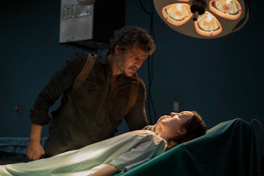 Joel (Bella Ramsey) looks at an unconscious Ellie (Bella Ramsey) in The Last of Us Episode 9