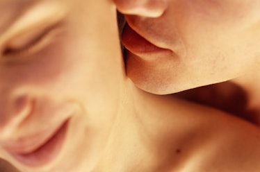 Close up of man kissing woman's neck to initiate sex 