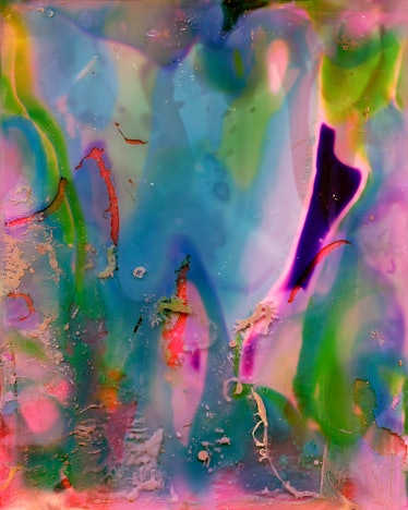 a multicolored watercolor looking photograph with pinks, greens, and blues