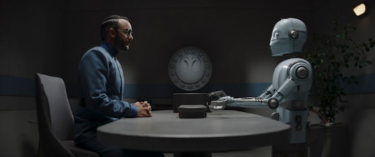 Dr. Penn Pershing (Omid Abtahi) and a Parole droid (Regina Hermosillo)