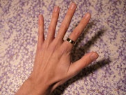 Hand wearing Oura ring