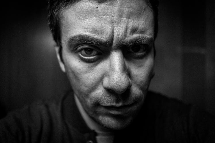 Close up photo of man who looks angry about a discussion taking place
