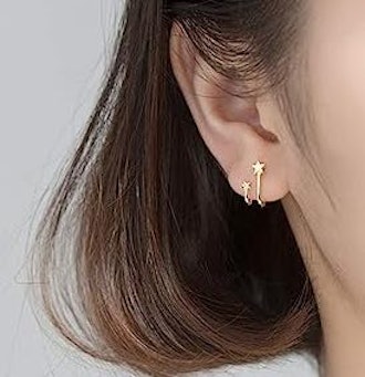 These twist earrings that look like multiple piercings have two tiny stars.