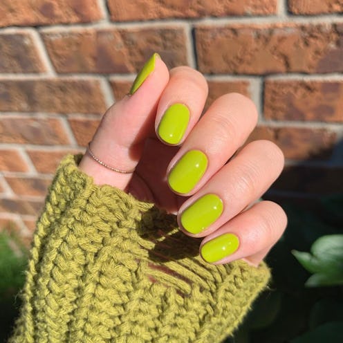 Bright orange is one of the best nail colors for spring 2023.