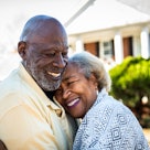 Older couple hugging and smiling joyfully