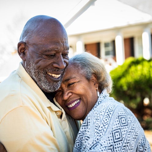 Older couple hugging and smiling joyfully