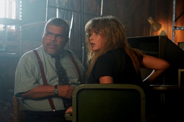 Luis Guzmán and Natasha Lyonne sit in a barn together in Poker Face Episode 8