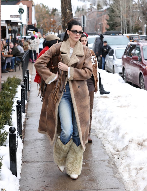 kendall jenner wears skinny jeans with fur cowboy boots in aspen co