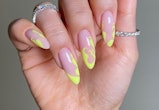  Try neon yellow flame nail art for Aries season 2023.