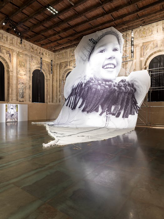 Artist JR's monumental tarp depicting a five-year-old named Valeriia—one of more than four million U...