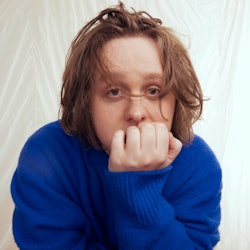 Lewis Capaldi, who has a new Netflix Doc, wearing a blue jumper