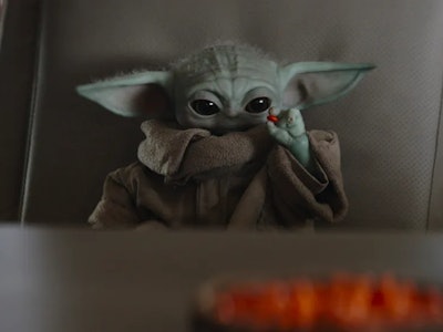 Baby Yoda using the Force to eat a space M&M.