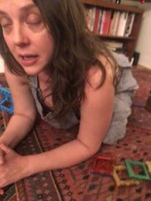 mom on the floor with magnatiles (eyes closed)