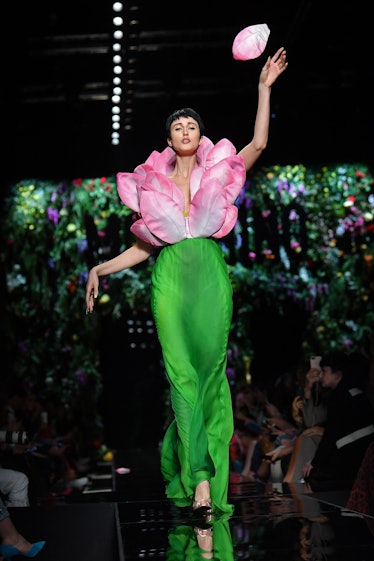 Model Anna Cleveland presents a creation for fashion house Moschino during the Women's Spring/Summer...