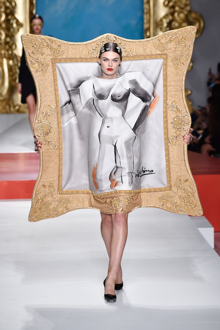 Cara Taylor walks the runway at the Moschino show during the Milan Fashion Week Spring/Summer 2020 o...