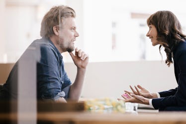 Man and woman having a calm, engaged discussion