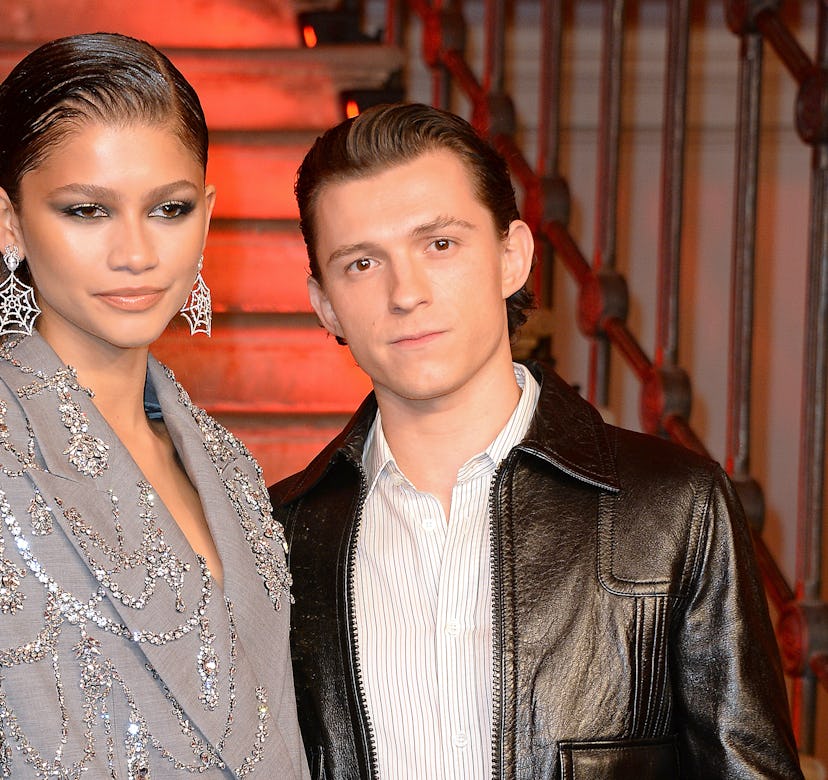 Zendaya and Tom Holland pose at a photocall for "Spider-Man: No Way Home"