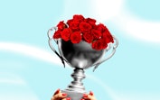 a trophy with roses to represent how the bachelor makes love a competition