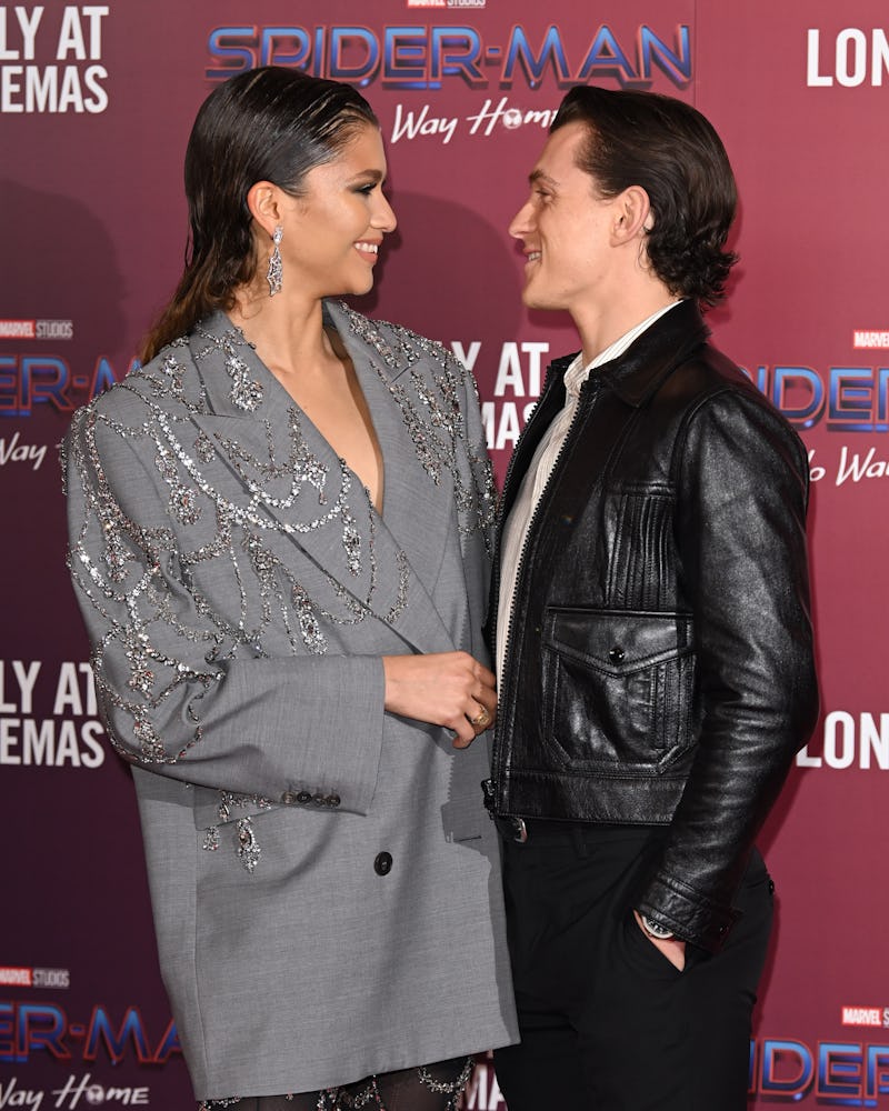 Zendaya and Tom Holland attend a photocall for "Spiderman: No Way Home" 