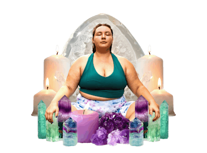 a woman meditating and clearing her energy with crystals and candles