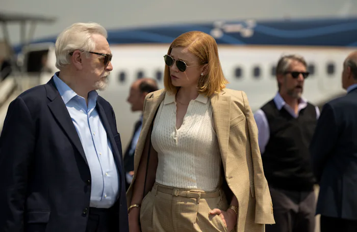 Shiv and Logan Roy scheme in a scene from HBO's Succession in an article about the Roy family tree.