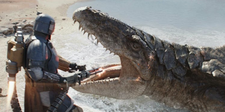 Paz Vizla fires his blaster at a giant underwater monster in The Mandalorian Season 3 Episode 1