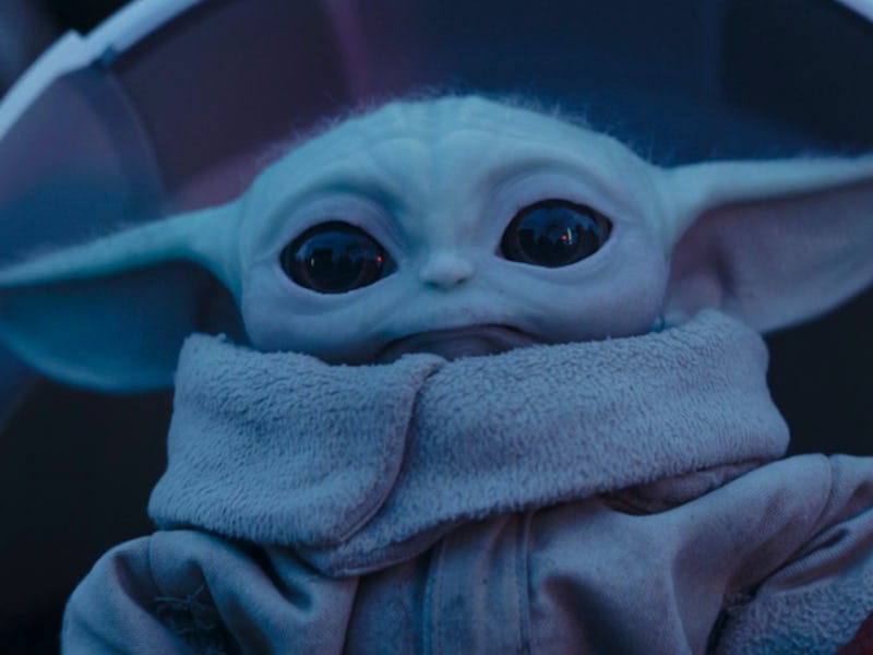 Grogu lit by the pale blue light of hyperspace in The Mandalorian Season 3 Episode 4