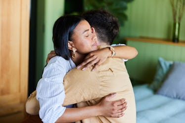 Man and woman embracing after a big fight