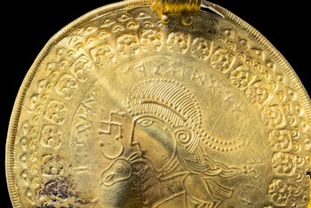 The inscription “He is Odin’s Man” is in a round half circle over the head of a man.
