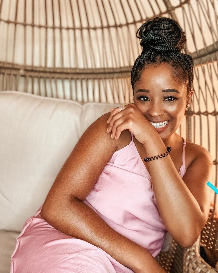 Travel influencer Taylor Patrick shares the best beach vacation hairstyles for Black women with natu...