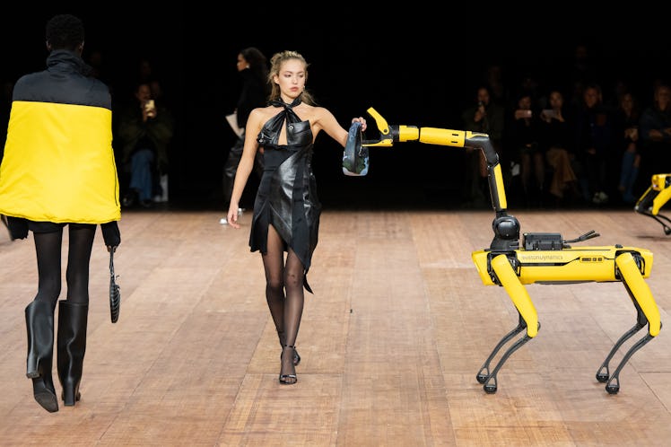 Lila Grace Moss walks the runway with a robot at the Coperni Womenswear Fall Winter 2023-2024 show d...