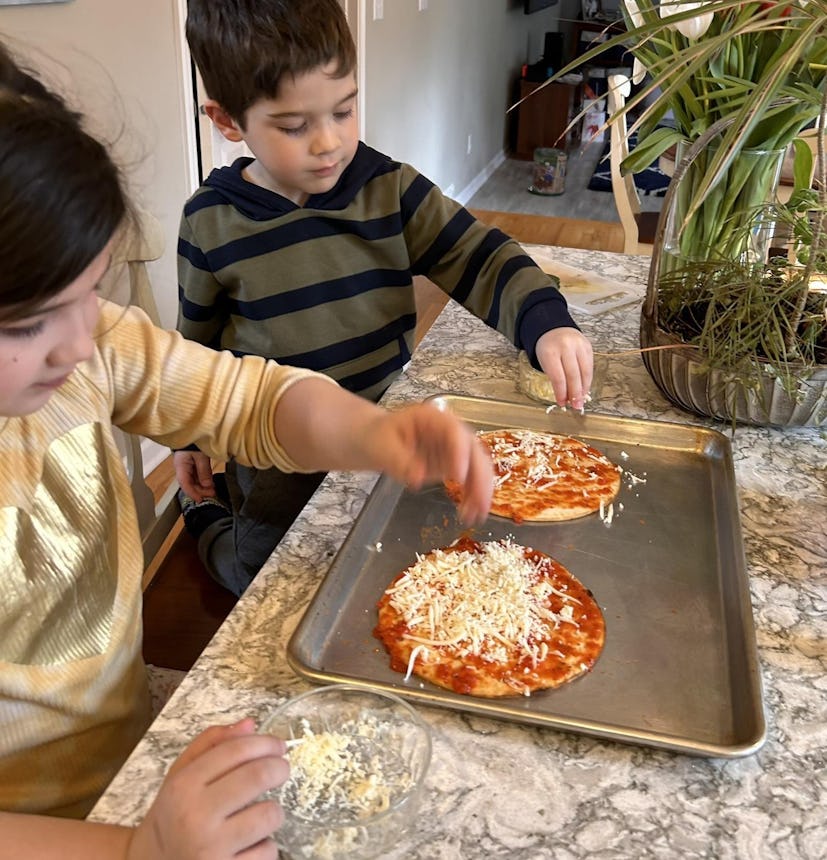 Writer Allison Kenien's kids making personal pizzas with Dollar Tree ingredients